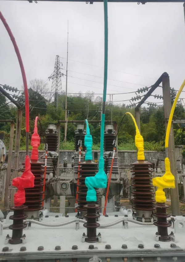 Colored transformer bushing protector on High-Voltage Terminals